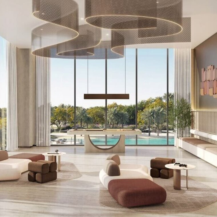 Residents' club lounge at Al Yalayis by Ellington — double-height glazing onto the pool, sculptural pendant lighting and low seating