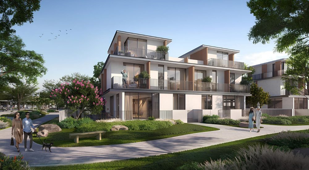 Townhouses and villas at Al Yalayis by Ellington — timber-framed balconies above landscaped gardens, with residents walking on shaded pathways