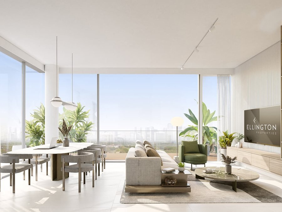 Apartment interior at Al Yalayis by Ellington — open-plan living and dining with floor-to-ceiling glazing, fluted timber joinery and a planted terrace beyond
